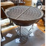 A wrought iron circular fire pit, diameter 61cm, height 66cm