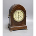 An early 20th century mahogany inlaid dome topped mantel clock,30 cms high.