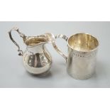 A George III engraved silver christening mug, London, 1810, 67mm and a later silver cream jug, 5oz.