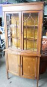 An Edwardian inlaid and satinwood banded mahogany bowfront display cabinet, width 92cm, depth