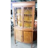 An Edwardian inlaid and satinwood banded mahogany bowfront display cabinet, width 92cm, depth