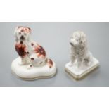 An unusual Staffordshire porcelain model of a seated poodle, 8.8cm high and a similar porcelain