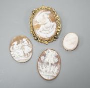 Two gilt metal mounted carved oval cameo shell cameos, largest 63mm and two similar unmounted