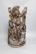 A Balinese carved coromandel deity group50 cms high.