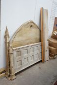 A large reproduction Gothic revival oak bedframe in the manner of Pugin, width 200cm