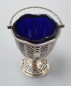 A George III pierced silver sugar basket, Burrage Davenport, London, 1777, with blue glass liner,