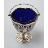 A George III pierced silver sugar basket, Burrage Davenport, London, 1777, with blue glass liner,