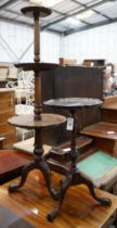 A reproduction George III style mahogany three tier dumb waiter together with a tripod wine table,