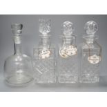 A pair of glass decanters, another similar and a mallet decanter and four decanter labels,Pair 27