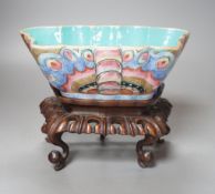 A 19th century Chinese enamelled porcelain ‘butterfly’ bowl, hongmu stand,21 cms wide x 8 cms high.