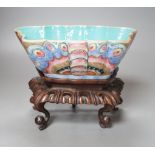 A 19th century Chinese enamelled porcelain ‘butterfly’ bowl, hongmu stand,21 cms wide x 8 cms high.
