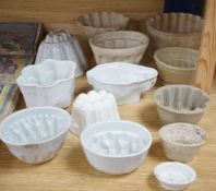 A collection of thirteen various sized 19th and 20th century ceramic jelly moulds,