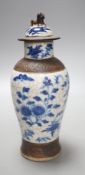 A Chinese blue and white crackle ware vase, c.1900,22cms high including cover.