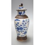 A Chinese blue and white crackle ware vase, c.1900,22cms high including cover.