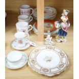 A collection of 19th century English porcelain plates and mugs and a Derby Cupid group, c.1775