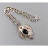 A modern silver and cabochon gem set pendant, on an oval link chain, by Michael Allen Bolton,