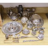 A quantity of assorted plated wares including a chamberstick, a tea set, flatware, a cocktail