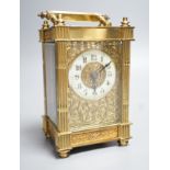 An early 20th century French brass carriage timepiece with fretted dial. 15.5cm