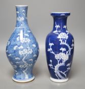 Two Chinese blue and white prunus vases,tallest 28cms high.