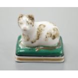 A rare English porcelain model of a recumbent cat, probably Derby c.1830, 4.5 cm longCf. Dennis G.
