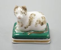 A rare English porcelain model of a recumbent cat, probably Derby c.1830, 4.5 cm longCf. Dennis G.
