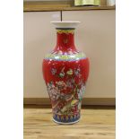 A large modern red ground Chinese vase with floral decoration - 68.5cm tall