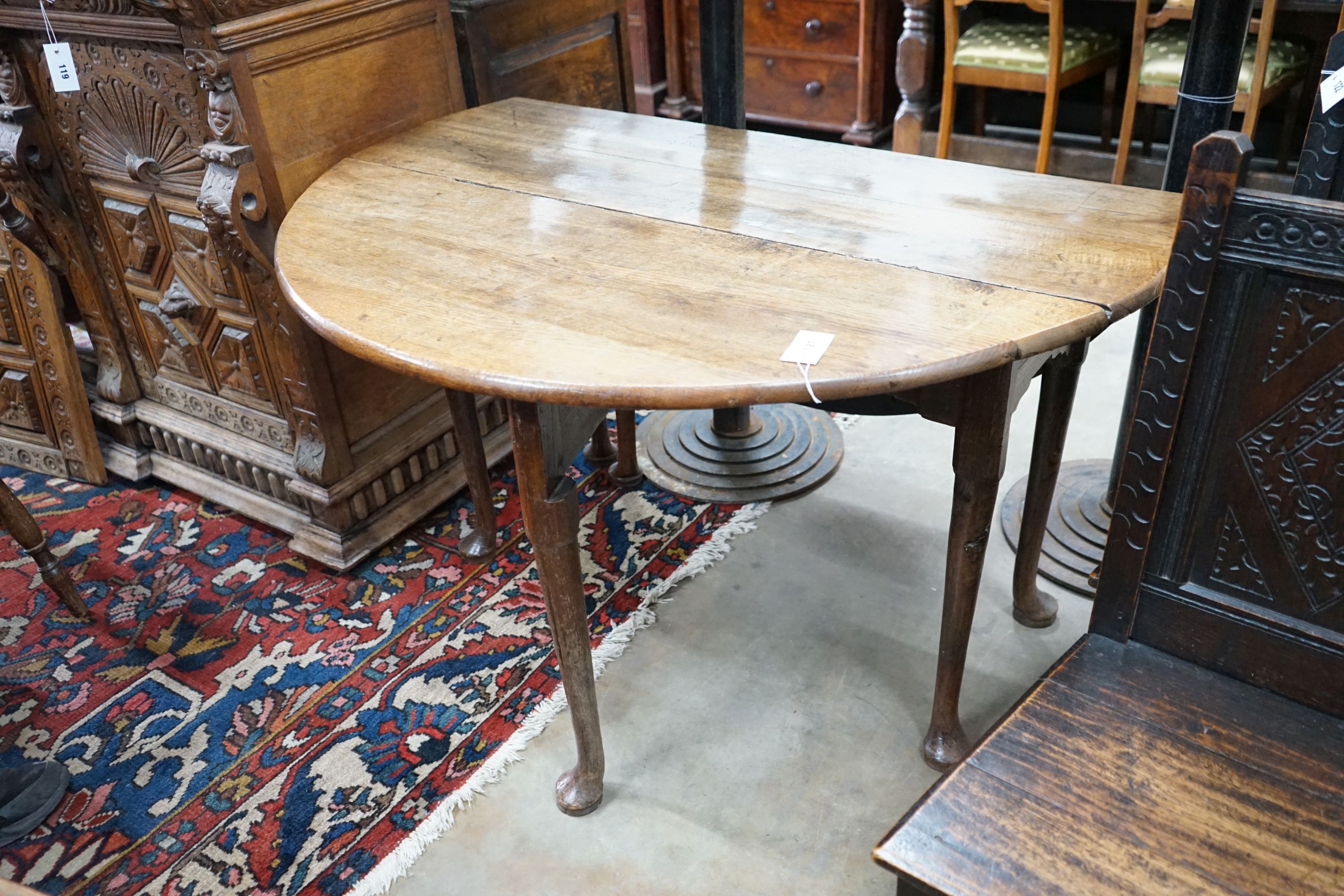 A George III provincial oak drop leaf pad foot dining table, length 120cm extended, width 120cm, - Image 2 of 3