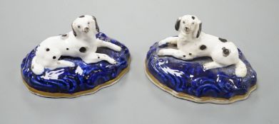 A pair of Samuel Alcock porcelain models of recumbent king Charles spaniels, c.1835-40, impressed