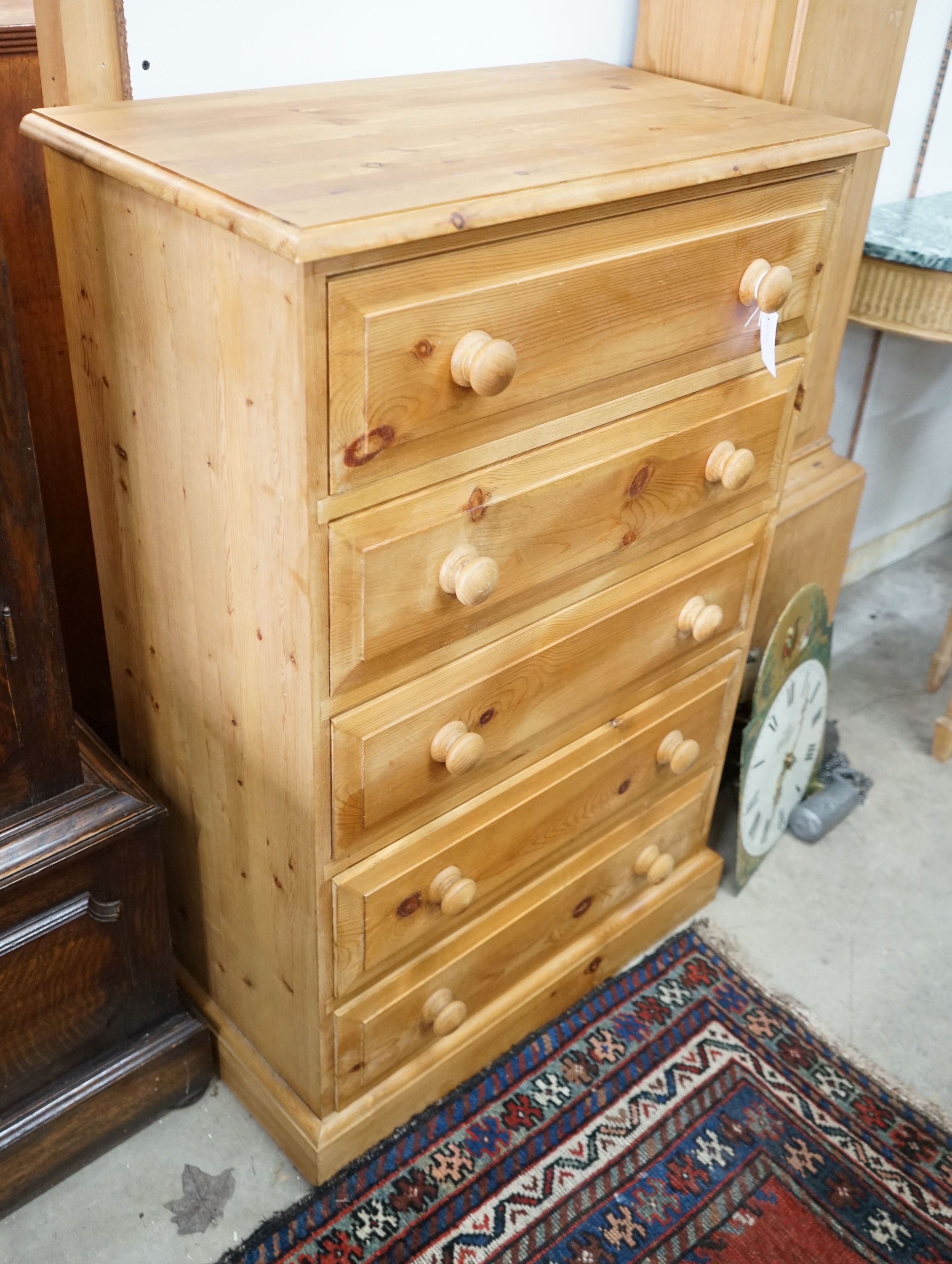 A small modern pine five drawer chest, width 69cm, depth 40cm, height 106cm