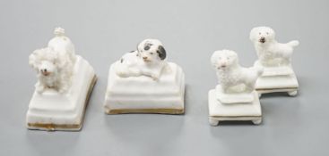 Four Staffordshire porcelain toy models of poodles and a King Charles spaniel puppy, c.1835-50,