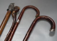 A silver mounted George V walking cane dated:London 1919 and 3 other canes,Silver mounted cane 92