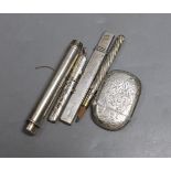 A silver vesta case, two silver pencil holders, one other plated holder and a white metal