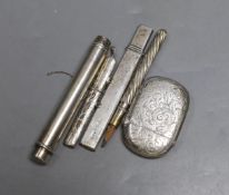 A silver vesta case, two silver pencil holders, one other plated holder and a white metal