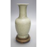 A Chinese celadon vase on stand,24 cms high including stand.