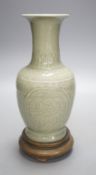 A Chinese celadon vase on stand,24 cms high including stand.