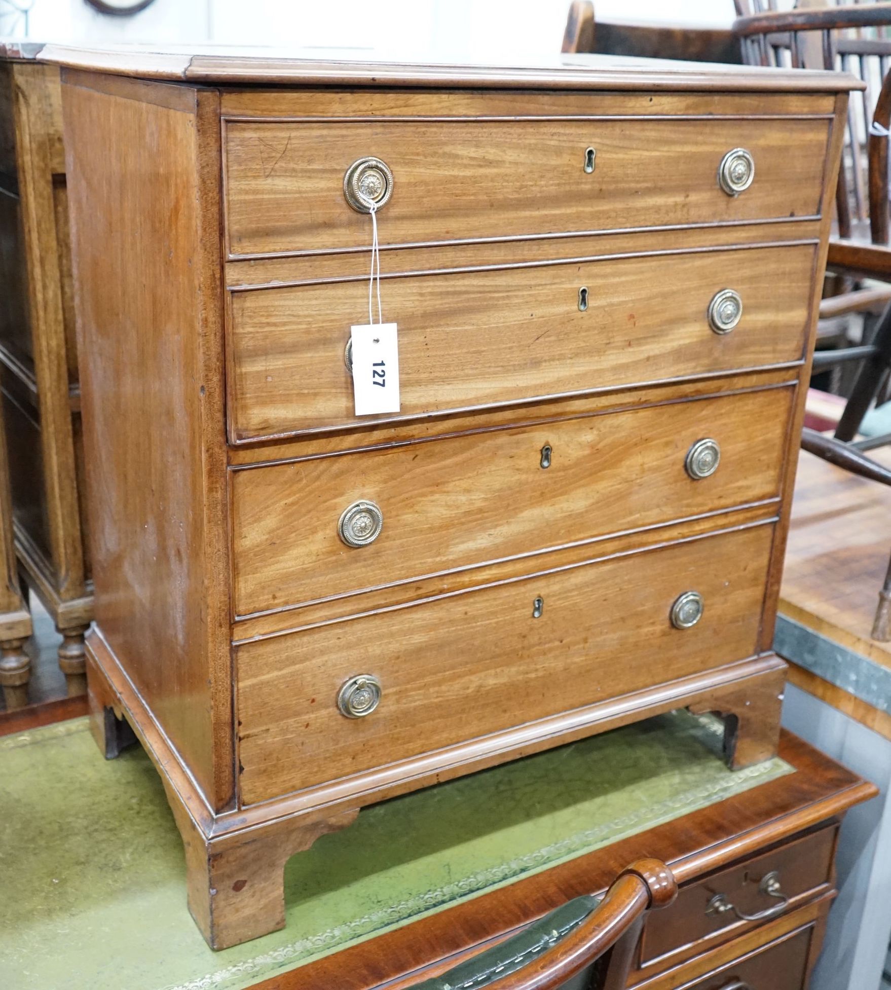 A George III mahogany hinged top commode with dummy drawer front and brass handles, width 66cm,