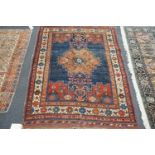 An antique Afshar blue ground rug, 180 x 130cm