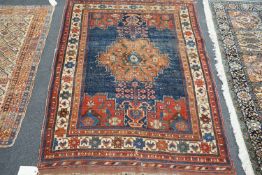 An antique Afshar blue ground rug, 180 x 130cm