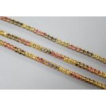 A modern Thai yellow metal and multi gem set necklace, 68cm and a similar bracelet stamped 585, 17.