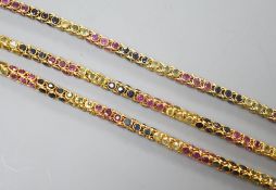 A modern Thai yellow metal and multi gem set necklace, 68cm and a similar bracelet stamped 585, 17.