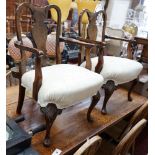 A pair of Queen Anne revival walnut child's elbow chairs, width 50cm, depth 42cm, height 79cm