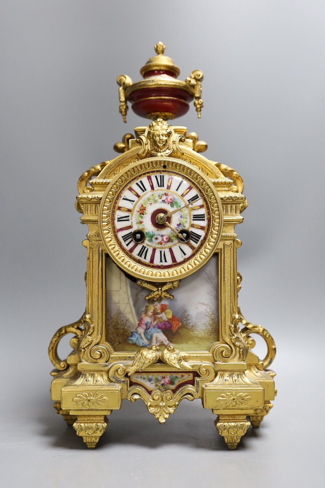 A French gilt spelter mantel clock, with porcelain figurative cartouche and enamelled dial,37 cms - Image 2 of 4