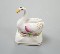 A Staffordshire porcelain model of a swan, c.1835-50, on a mound base, 5.4 cm highProvenance: Dennis