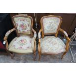 A pair of Louis XVI style carved beech fauteuils