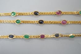 A modern Thai yellow metal and oval multi gem set necklace, 68cm and a similar bracelet, stamped
