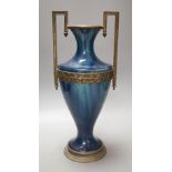 A French blue-glazed vase with embossed metal mounts, c.190037 cms high.