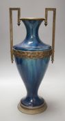 A French blue-glazed vase with embossed metal mounts, c.190037 cms high.