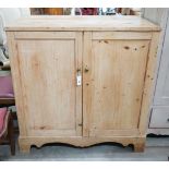 A 19th century pine part hinged top press cupboard, length 107cm, depth 61cm