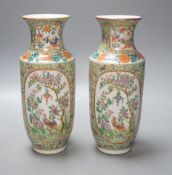 A pair of Chinese 19th century Chinese Canton decorated famille rose vases - 25cm tall