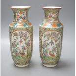 A pair of Chinese 19th century Chinese Canton decorated famille rose vases - 25cm tall